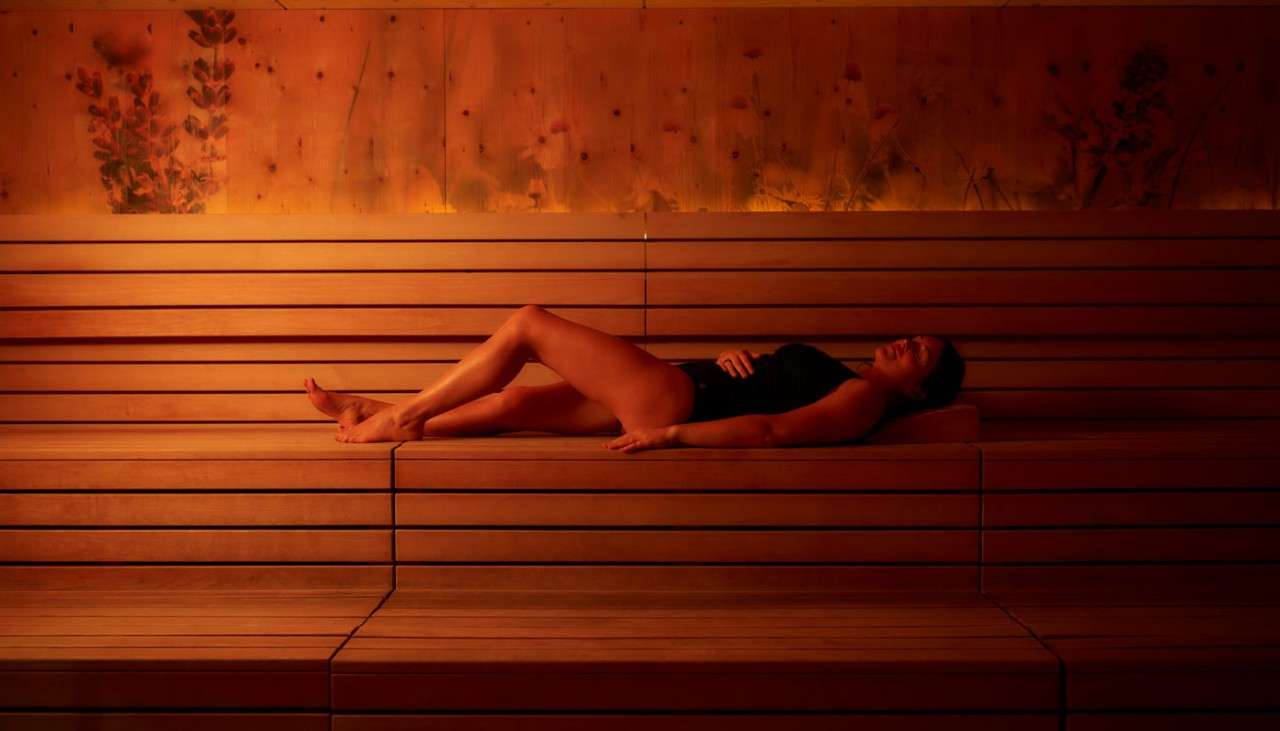 Woman laid inside a Herbal Sauna